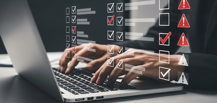 Digital checklist with alerts over laptop screen