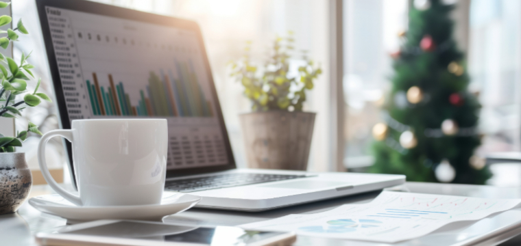 Laptop with charts in festive office