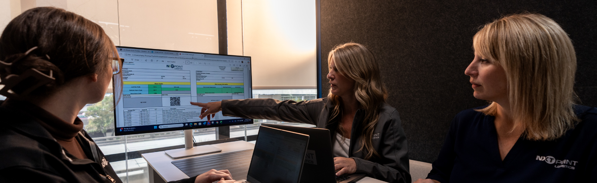 team members reviewing data on screen