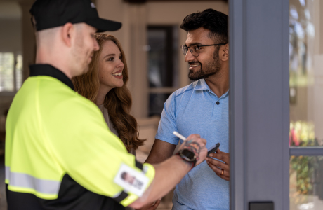 delivery man with happy customers