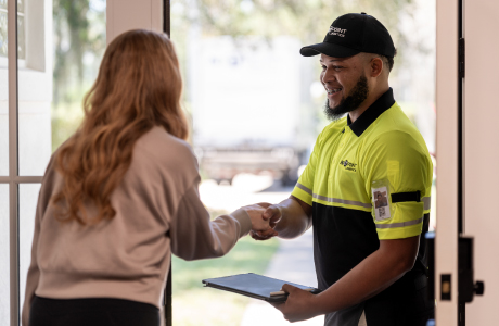 delivery man shaking hands with customer