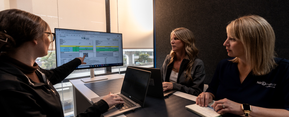 team members reviewing data on screen