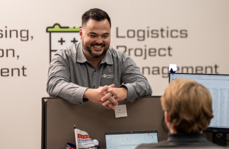 team members talking in cubicle