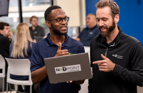 team members collaborating with computer