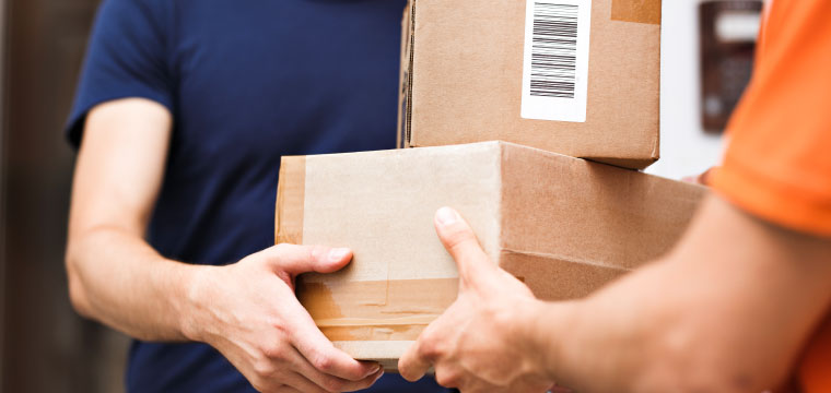 People handing off boxes