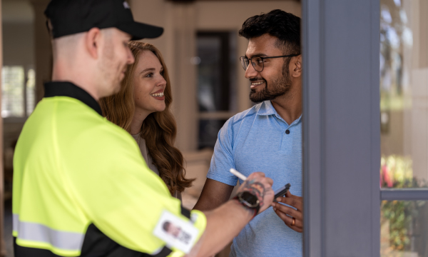 Delivery team and customer shaking hands - featured
